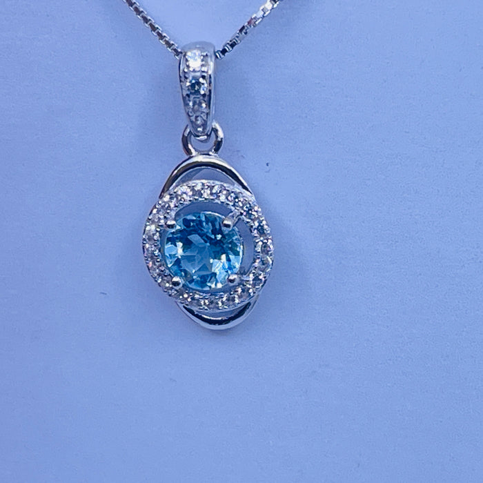 Sterling Silver lab Aquamarine Pendant with cz side stones