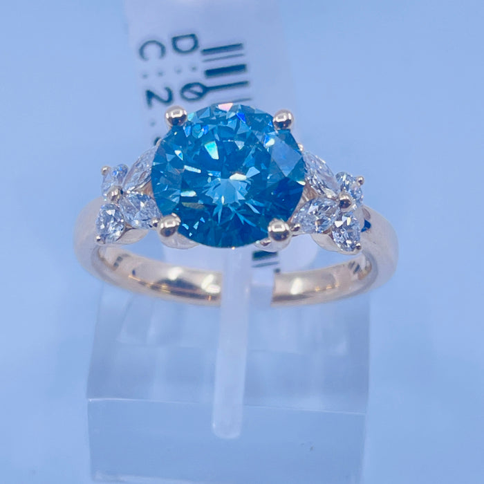 14kt Yellow Gold prong set 2.50ct Round lab grown Blue Diamond Engagement Ring with 8 side diamonds @.52ctw