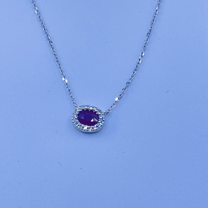 14kt White Gold .25ct Ruby Pendant with a Diamond Halo