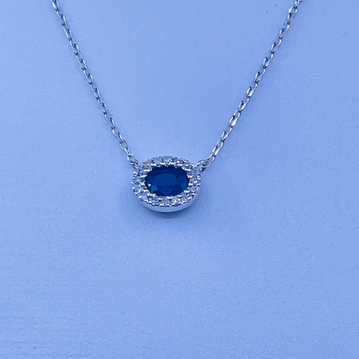 14kt White Gold .30ct Sapphire Pendant with a Diamond Halo