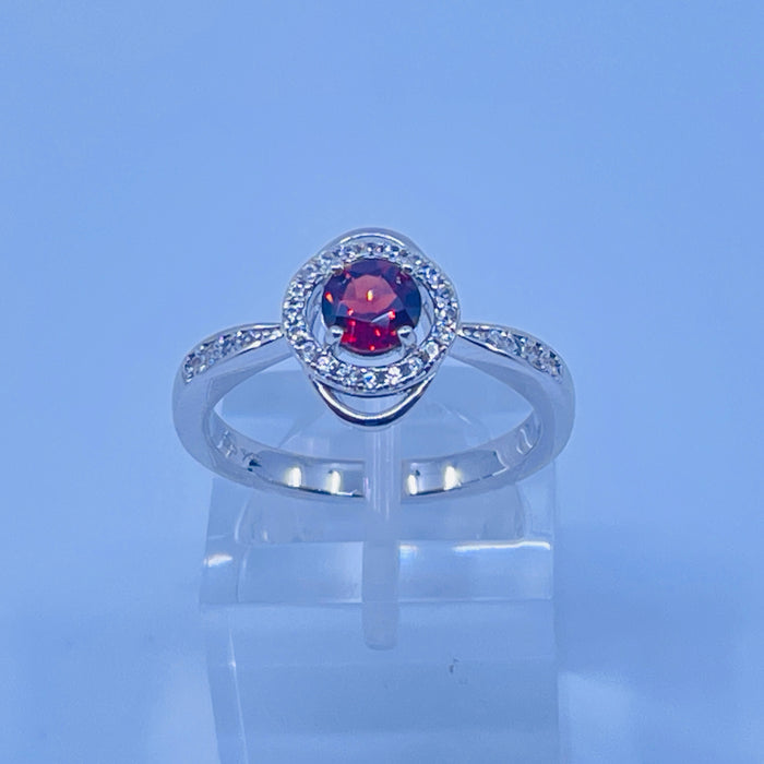 Sterling Silver Garnet ring with cz side stones