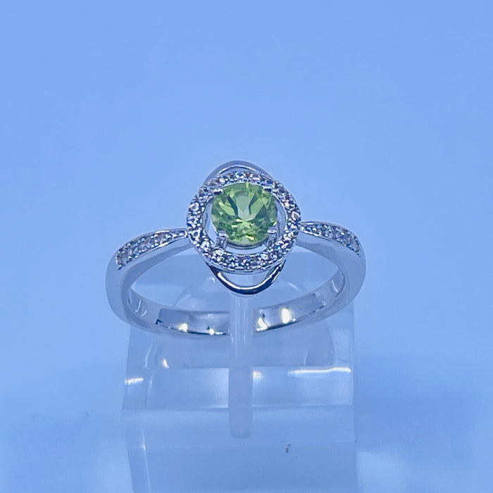 Sterling Silver Peridot ring with cz side stones