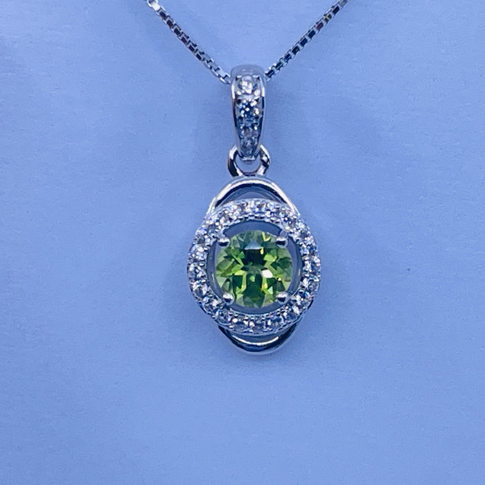 Sterling Silver Peridot Pendant with cz side stones