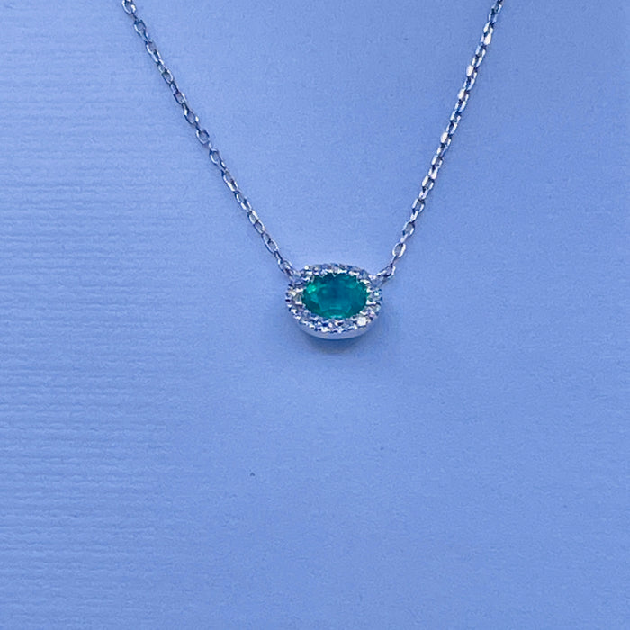 14kt White Gold .17ct Emerald Pendant with a Diamond Halo