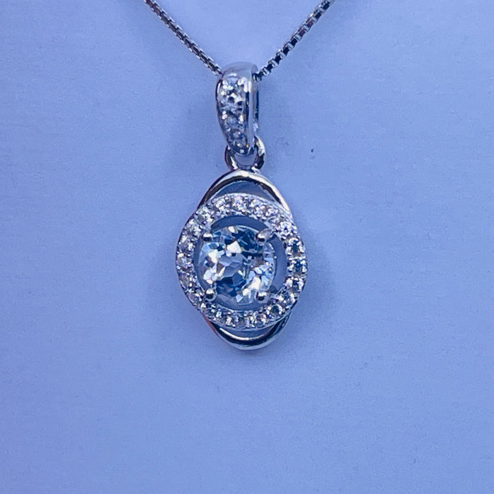 Sterling Silver White Topaz (April) Pendant with cz side stones