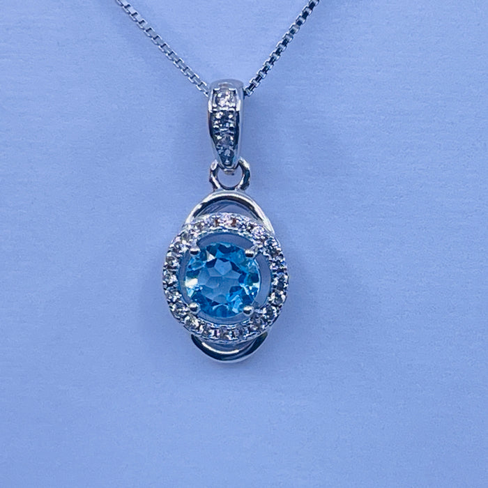 Sterling Silver Blue Topaz Pendant with cz side stones