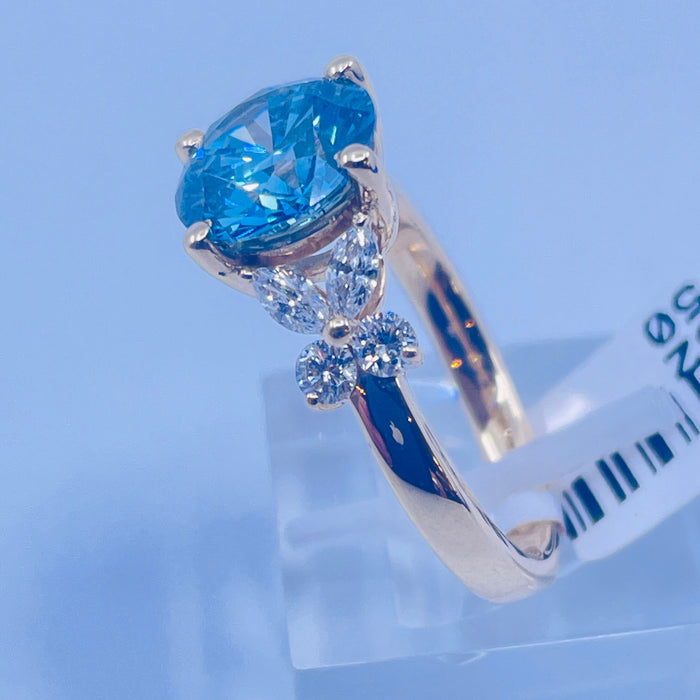 14kt Yellow Gold prong set 2.50ct Round lab grown Blue Diamond Engagement Ring with 8 side diamonds @.52ctw