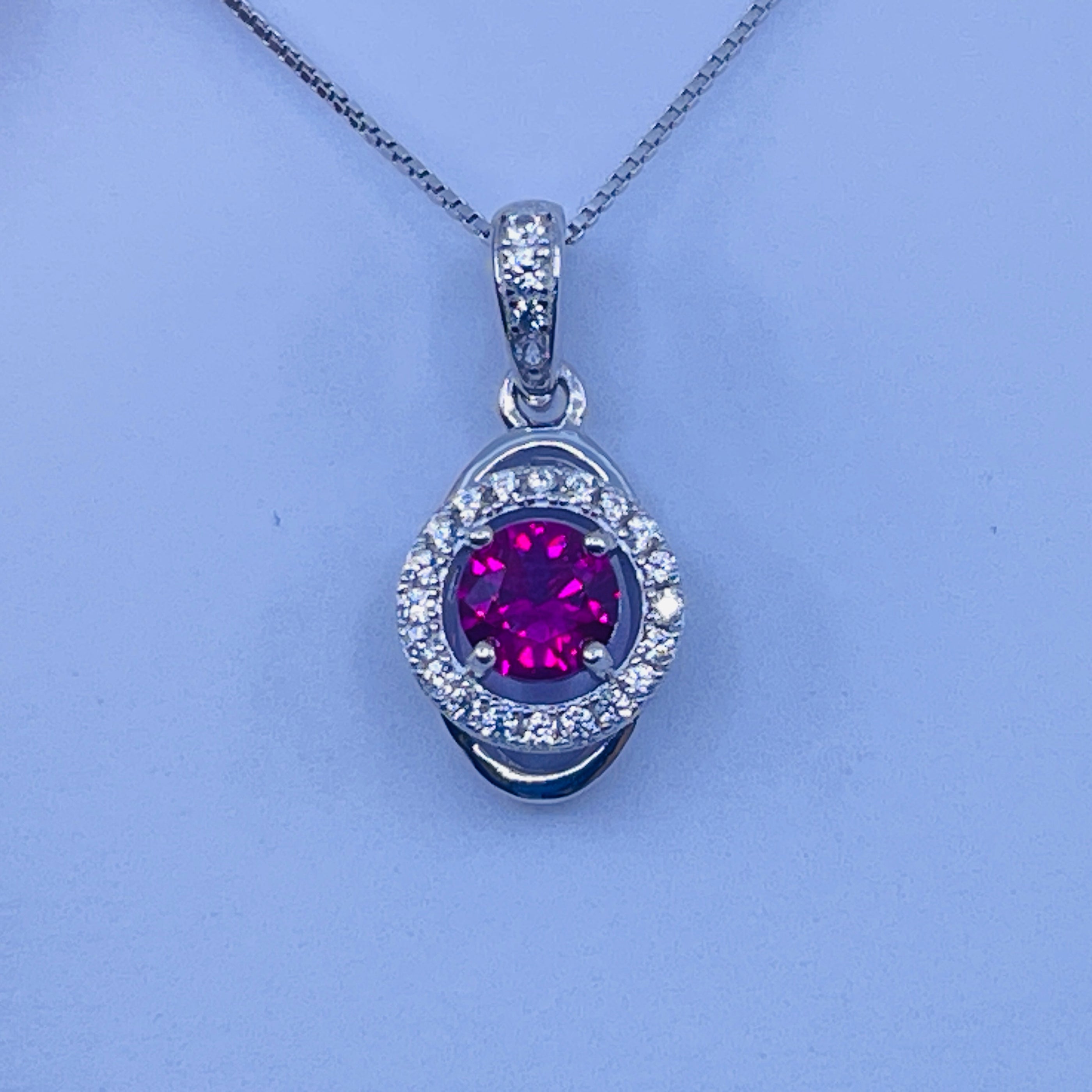 Sterling Silver Lab Ruby Pendant with cz side stones – Prairie Jewelers