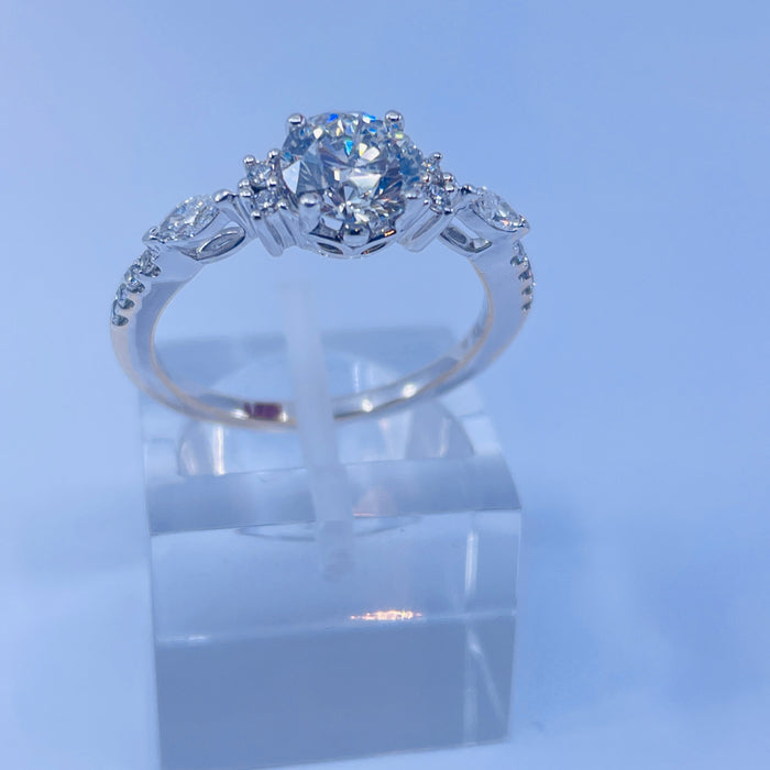 18kt White Gold Engagement Ring. 1.03ct E SI2 center with round and marquise side stones.