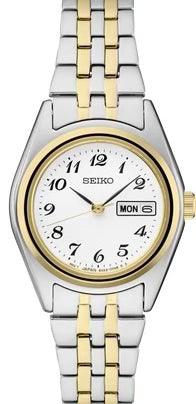 Ladies Seiko crafted of stainless steel in versatile two-tone finish, this perfectly balanced watch features a white dial with Arabic numerals and day/date calendar for a superb blend of clarity and style. 10 bar, 100M Water Resistant