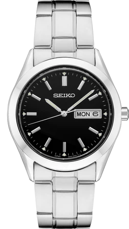 Gents Seiko crafted of durable stainless steel, with both polished and brushed finishes, this perfectly tailored design features a black sunray dial with day/date calendar and LumiBrite hands and markers. 10 bar, 100M Water Resistant