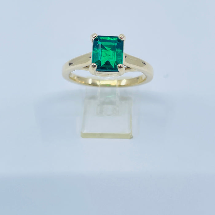 1.53ct  7.4 x 6.31mm Emerald set into a 14kt yellow gold mounting