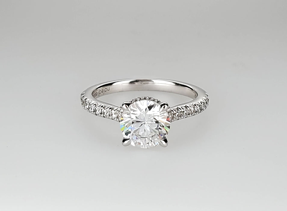 Four claw diamond shank and collar engagement ring set with no less than 0.29 carats.