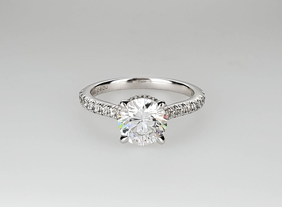 Four claw diamond shank and collar engagement ring set with no less than 0.29 carats.