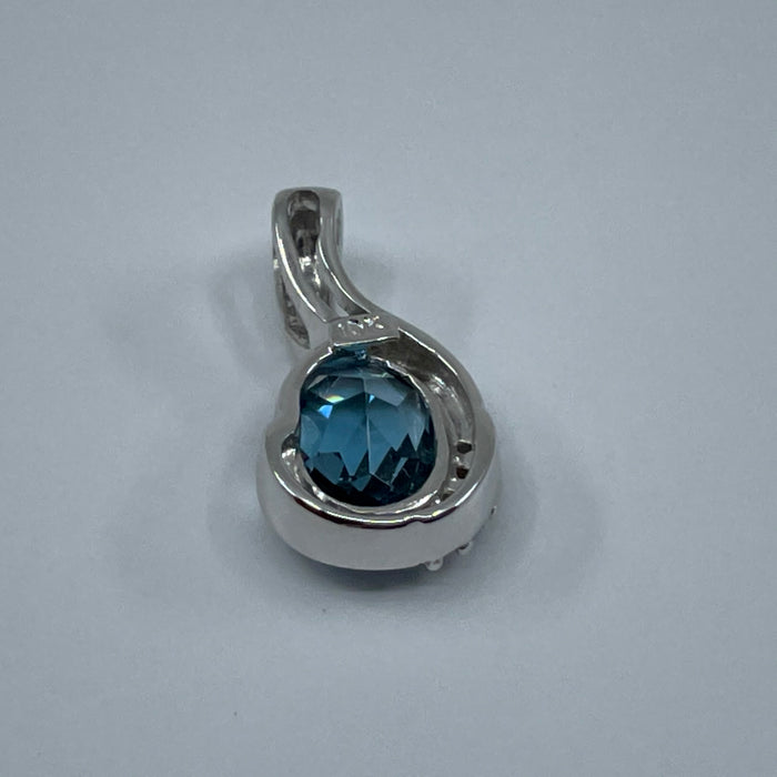 10kt White Gold blue topaz and diamond pendant