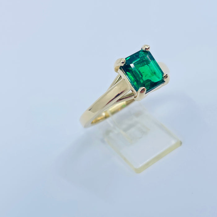 1.53ct  7.4 x 6.31mm Emerald set into a 14kt yellow gold mounting