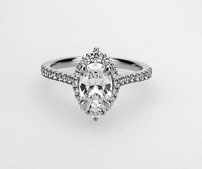 Graduated diamond halo ring with fancy wire cage head Mounting
