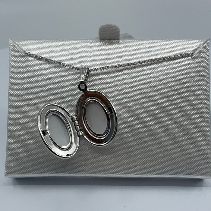 Rhodium finish oval locket