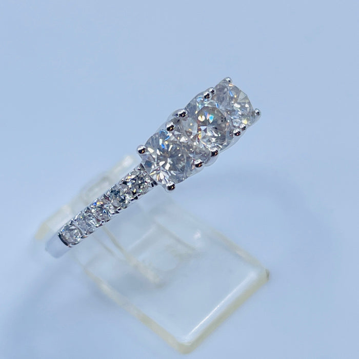 14kt White Gold Three stone ring with side diamonds