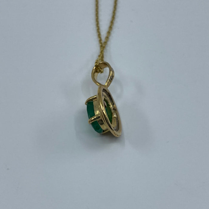 14kt Yellow Gold 7x5mm oval natural emerald pendant