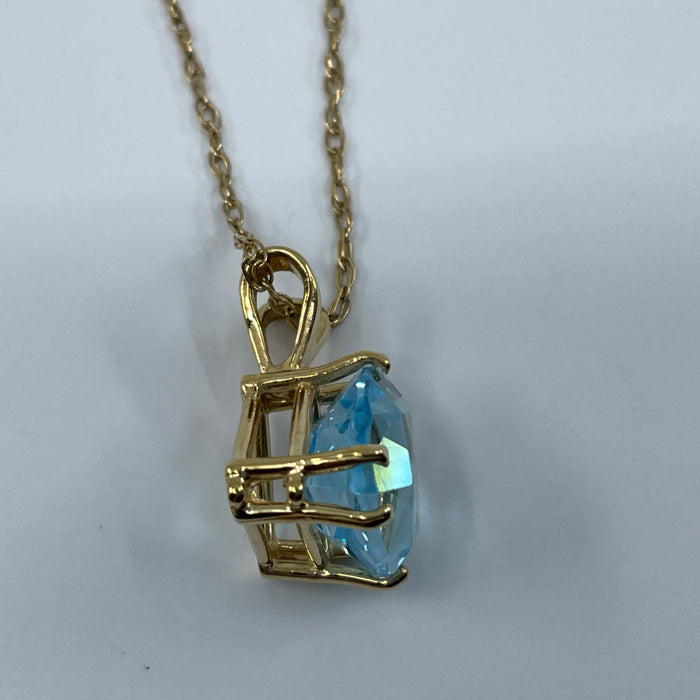 14kt yellow gold trillion cut Blue Topaz pendant