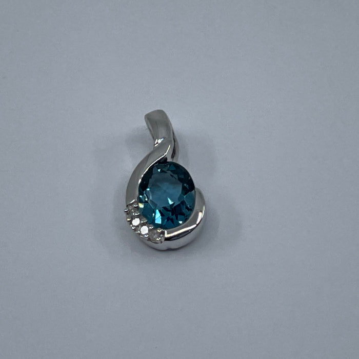 10kt White Gold blue topaz and diamond pendant