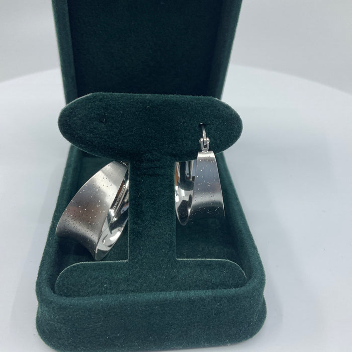 Sterling Silver hoop earrings with distressed finish and pinholes for light distribution