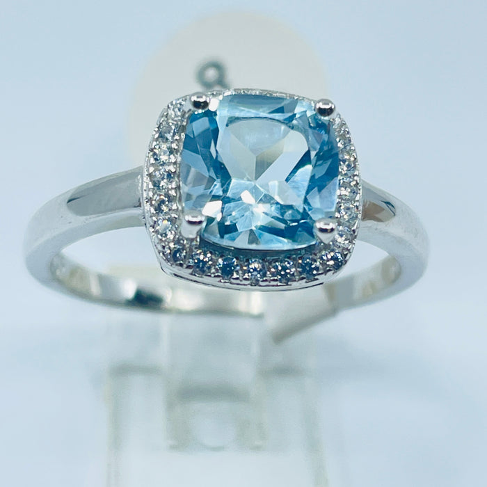 Sterling Silver Blue Topaz Ring with a CZ halo, size 8