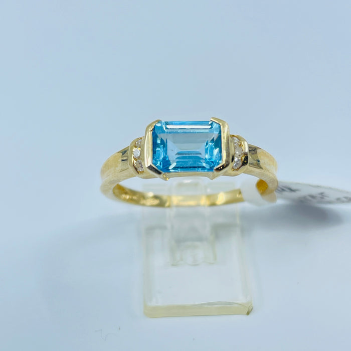 14kt Yellow Gold Blue Topaz and 6 diamond ring