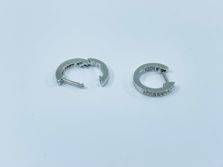 Sterling Silver diamond huggie earrings .03ctw