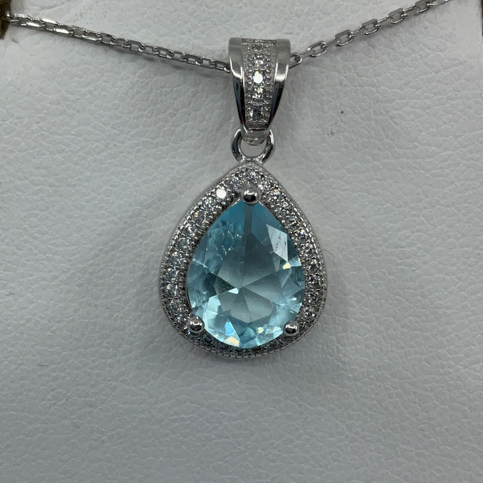 Sterling Silver Teardrop Simulated Blue Topaz with Cubic Zirconia Border Pendant