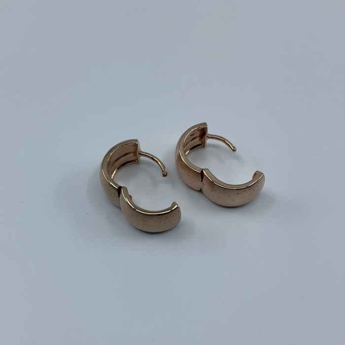 Sterling silver rose tone huggie earrings